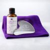 Ramedicare Gua Sha tool and botanical oil set with lavender and chamomile on purple microfibre towel