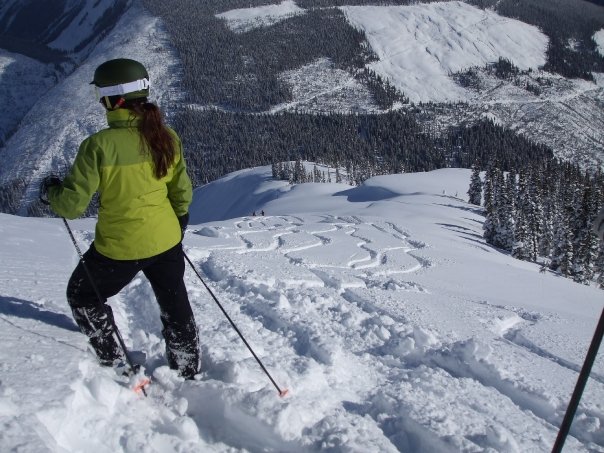 Jaime overlooking fresh powder ski tracks in the Bugaboos, British Columbia.